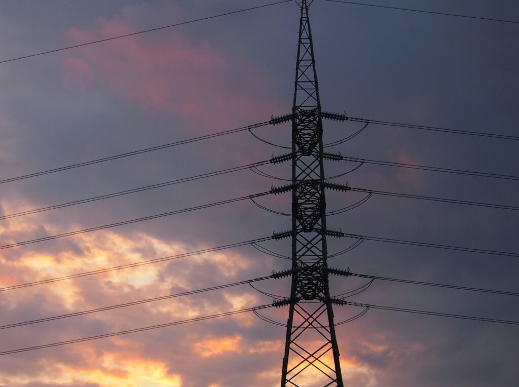 a tall tower with lots of power lines