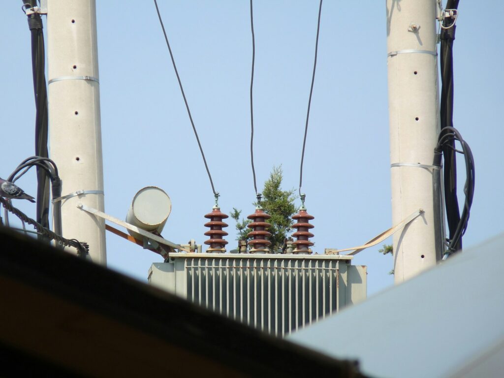 a view of some power lines and a tower